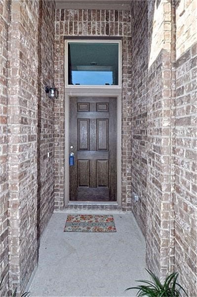 15619 Hanover Breeze Ln, Houston, TX 77044 - doorway to property with brick siding
