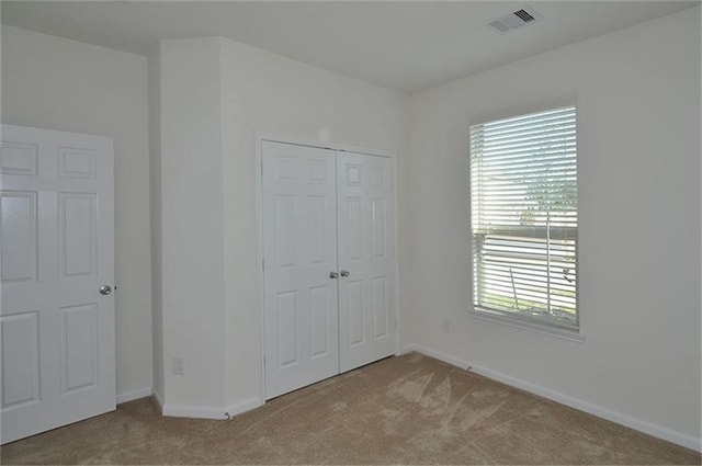 15619 Hanover Breeze Ln, Houston, TX 77044 - unfurnished bedroom featuring carpet floors and a closet