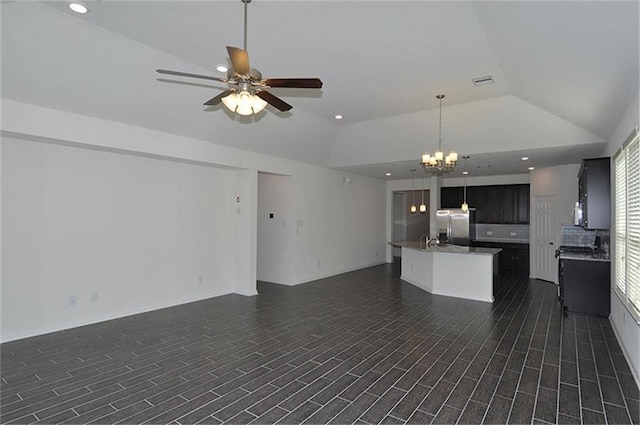15619 Hanover Breeze Ln, Houston, TX 77044 - unfurnished living room featuring lofted ceiling, ceiling fan, a chandelier, and recessed lighting