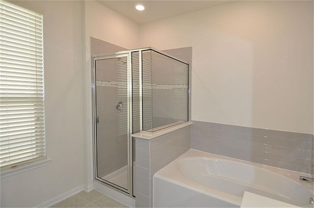 15619 Hanover Breeze Ln, Houston, TX 77044 - bathroom with a bath, a shower stall, tile patterned flooring, and recessed lighting