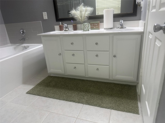 15619 Hanover Breeze Ln, Houston, TX 77044 - full bath featuring tile patterned floors, double vanity, and a garden tub