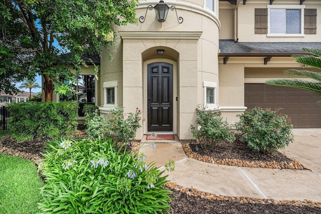3038 S Island Dr, Seabrook, TX 77586 - property entrance featuring a garage, stucco siding, and concrete driveway
