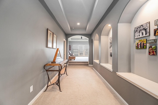 3038 S Island Dr, Seabrook, TX 77586 - hall featuring arched walkways, light carpet, and recessed lighting
