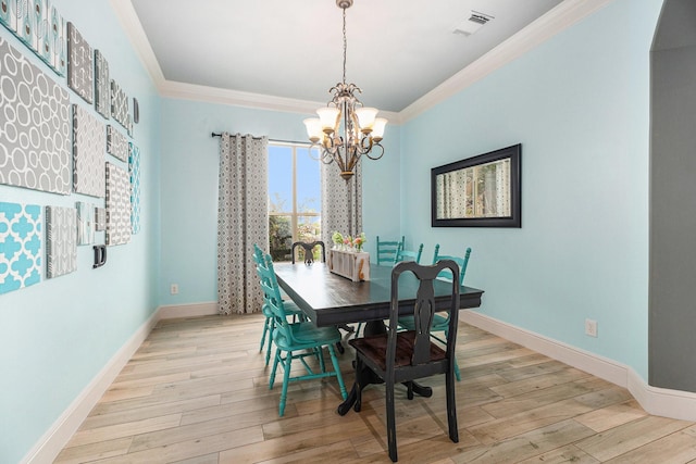 3038 S Island Dr, Seabrook, TX 77586 - dining room with a chandelier, ornamental molding, wood finished floors, and arched walkways
