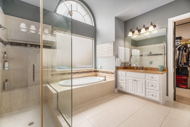 3038 S Island Dr, Seabrook, TX 77586 - full bath with tile patterned flooring, vanity, a shower stall, and a garden tub