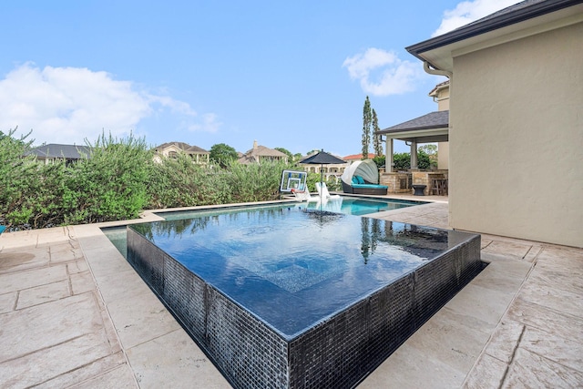 3038 S Island Dr, Seabrook, TX 77586 - outdoor pool featuring a patio area and exterior kitchen