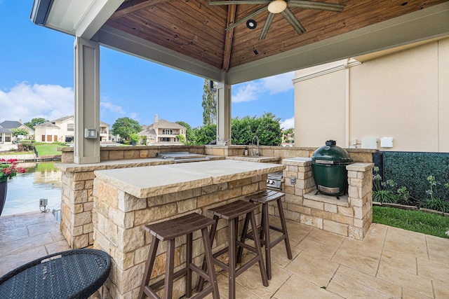 3038 S Island Dr, Seabrook, TX 77586 - view of patio featuring exterior kitchen, a residential view, and a ceiling fan