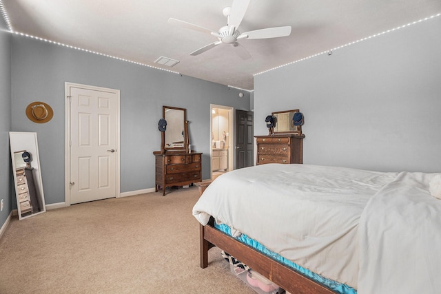3038 S Island Dr, Seabrook, TX 77586 - carpeted bedroom with ensuite bathroom and ceiling fan