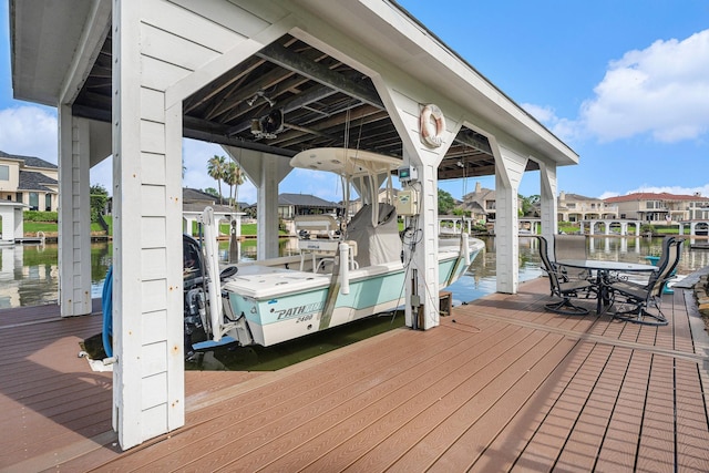3038 S Island Dr, Seabrook, TX 77586 - dock area featuring boat lift, a water view, and a residential view