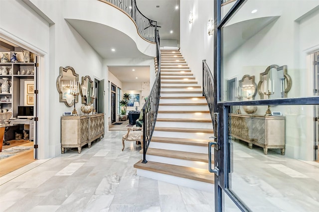 4622 Banning Dr, Houston, TX 77027 - stairs featuring a high ceiling and marble finish floors