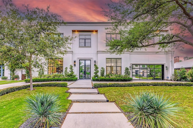 4622 Banning Dr, Houston, TX 77027 - contemporary house featuring french doors, a yard, and stucco siding