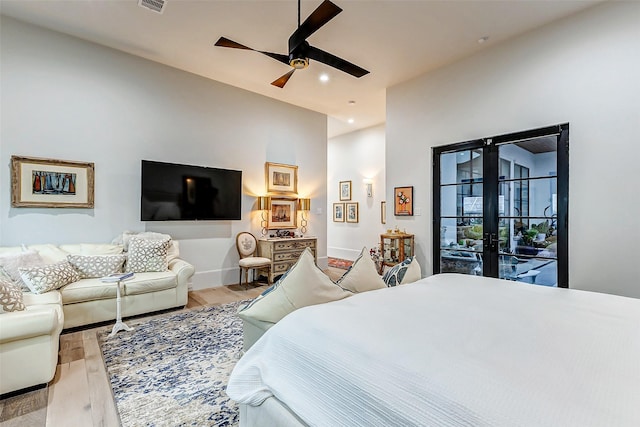 4622 Banning Dr, Houston, TX 77027 - bedroom featuring french doors, light wood-style flooring, ceiling fan, recessed lighting, and access to outside