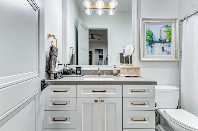 4622 Banning Dr, Houston, TX 77027 - bathroom with vanity, ceiling fan, and a shower with shower curtain