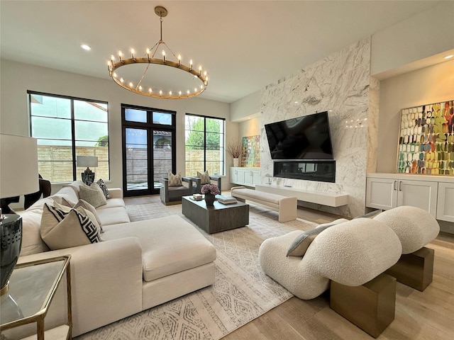 4622 Banning Dr, Houston, TX 77027 - living room with a chandelier, wood finished floors, and recessed lighting
