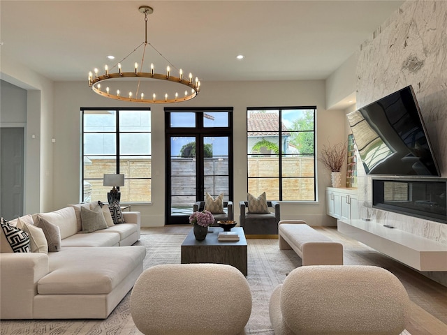 4622 Banning Dr, Houston, TX 77027 - living area with a chandelier, plenty of natural light, light wood-type flooring, and recessed lighting