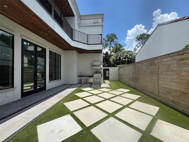 4622 Banning Dr, Houston, TX 77027 - patio / terrace with a fenced backyard, area for grilling, and a patio area