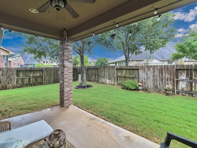 3314 Flint Valley Ln, Katy, TX 77494 - fenced backyard with ceiling fan and a patio