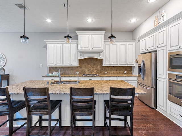 3314 Flint Valley Ln, Katy, TX 77494 - kitchen featuring stainless steel appliances, backsplash, dark wood-style floors, light stone counters, and recessed lighting