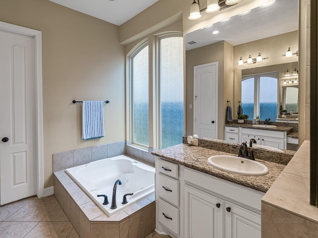 3314 Flint Valley Ln, Katy, TX 77494 - full bathroom with two vanities and a whirlpool tub
