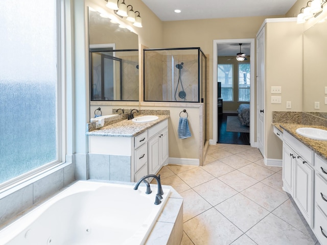 3314 Flint Valley Ln, Katy, TX 77494 - bathroom featuring two vanities, a stall shower, a whirlpool tub, and connected bathroom