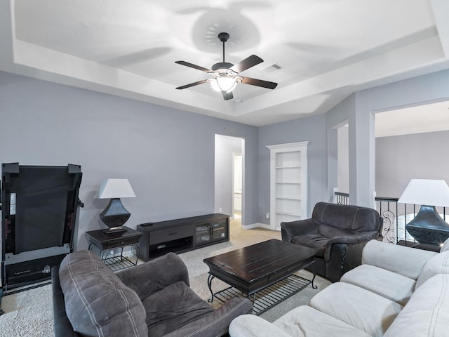3314 Flint Valley Ln, Katy, TX 77494 - carpeted living room featuring a tray ceiling and a ceiling fan
