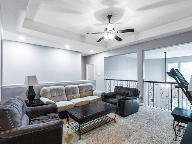 3314 Flint Valley Ln, Katy, TX 77494 - living area featuring a ceiling fan, carpet, a tray ceiling, and recessed lighting