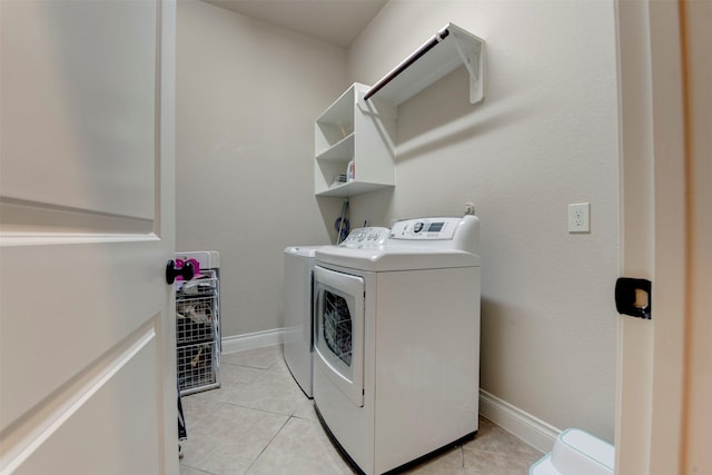 2407 Lost Bridge Ln, Pearland, TX 77584 - washroom with separate washer and dryer and light tile patterned floors