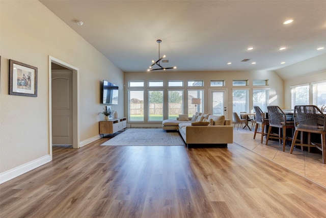 2407 Lost Bridge Ln, Pearland, TX 77584 - living room featuring plenty of natural light, a chandelier, wood finished floors, and recessed lighting