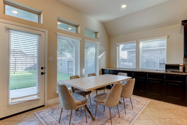 2407 Lost Bridge Ln, Pearland, TX 77584 - dining room with light tile patterned flooring, vaulted ceiling, and recessed lighting