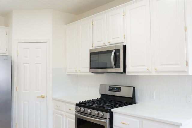 2415 Jasmine Ridge Ct, Houston, TX 77062 - kitchen with stainless steel appliances, white cabinets, and light countertops