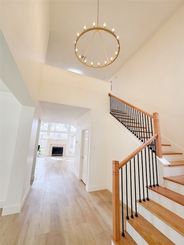 2415 Jasmine Ridge Ct, Houston, TX 77062 - corridor with wood finished floors, a chandelier, and stairway