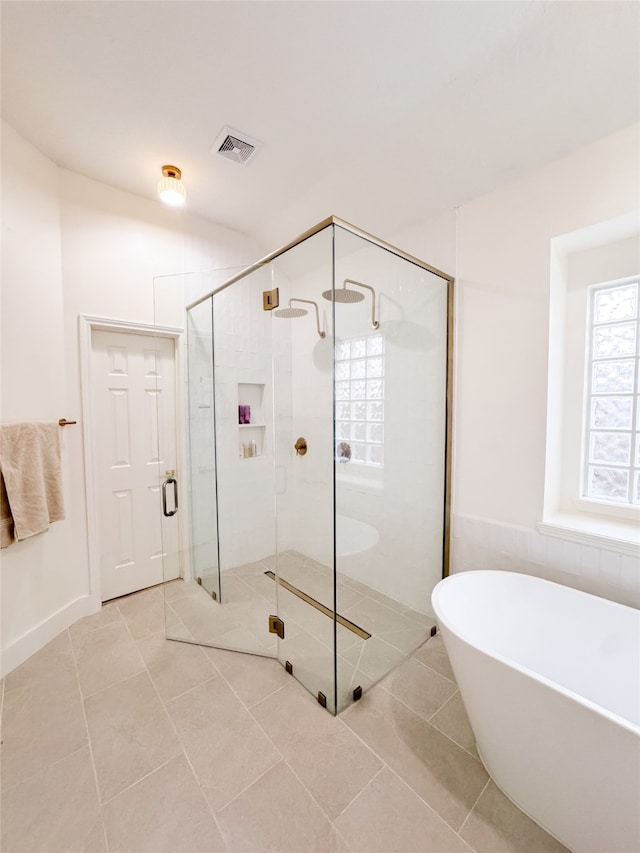 2415 Jasmine Ridge Ct, Houston, TX 77062 - bathroom with a freestanding tub, a stall shower, and tile patterned floors