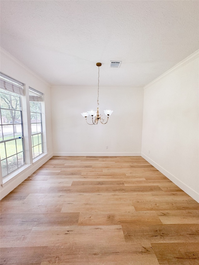 2415 Jasmine Ridge Ct, Houston, TX 77062 - unfurnished room with crown molding, light wood-style floors, and a chandelier