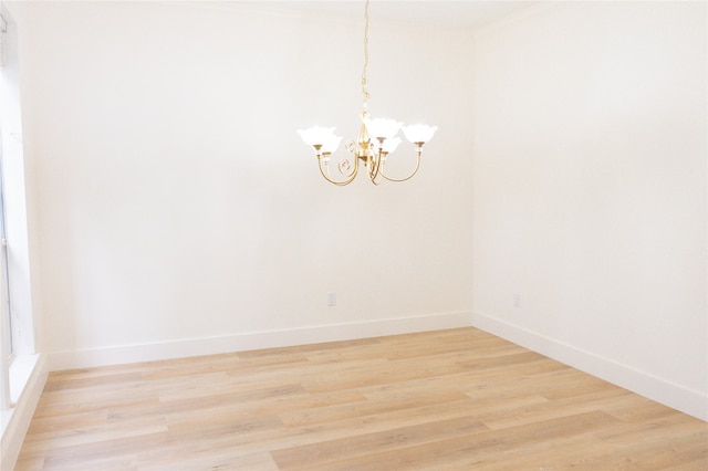 2415 Jasmine Ridge Ct, Houston, TX 77062 - empty room featuring a chandelier and light wood-type flooring