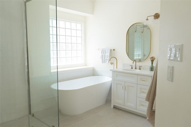 2415 Jasmine Ridge Ct, Houston, TX 77062 - bathroom with healthy amount of natural light, vanity, a soaking tub, and a shower stall