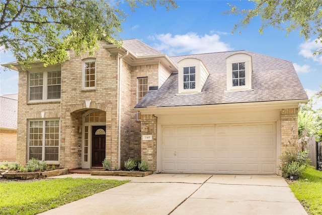 2415 Jasmine Ridge Ct, Houston, TX 77062 - view of front facade featuring brick siding, concrete driveway, a shingled roof, and an attached garage