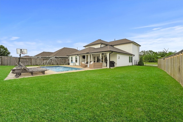 2307 Hagerman Rd, Conroe, TX 77384 - rear view of property featuring outdoor lounge area, a patio, and a fenced backyard