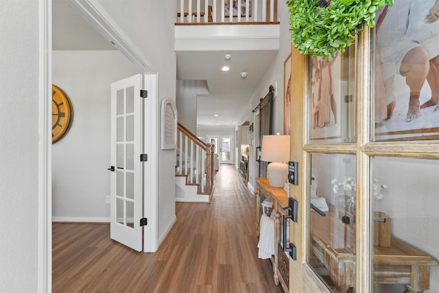 2307 Hagerman Rd, Conroe, TX 77384 - foyer entrance featuring french doors, wood finished floors, and stairway