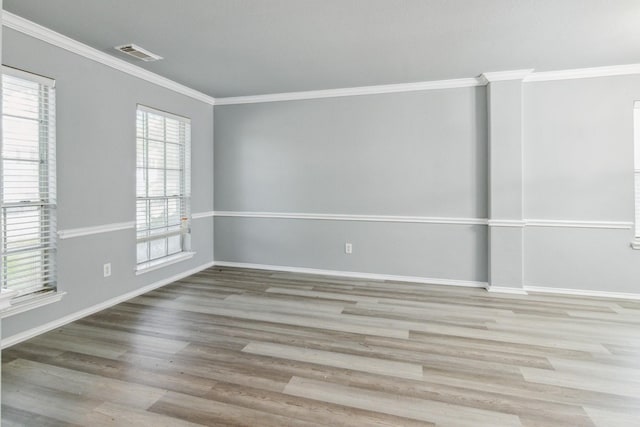 5911 Drenner Park Ln, Houston, TX 77086 - spare room with wood finished floors and crown molding