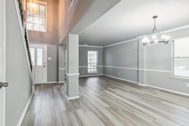 5911 Drenner Park Ln, Houston, TX 77086 - entryway featuring a chandelier, ornamental molding, and wood finished floors