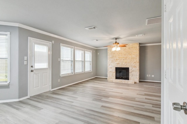 5911 Drenner Park Ln, Houston, TX 77086 - unfurnished living room with ornamental molding, wood finished floors, ceiling fan, and a large fireplace