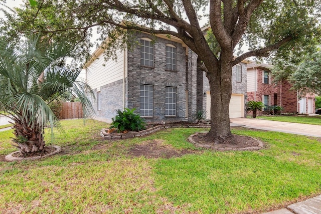 5911 Drenner Park Ln, Houston, TX 77086 - view of front facade featuring driveway, brick siding, and a garage