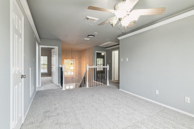 5911 Drenner Park Ln, Houston, TX 77086 - spare room with carpet, attic access, ceiling fan, and crown molding