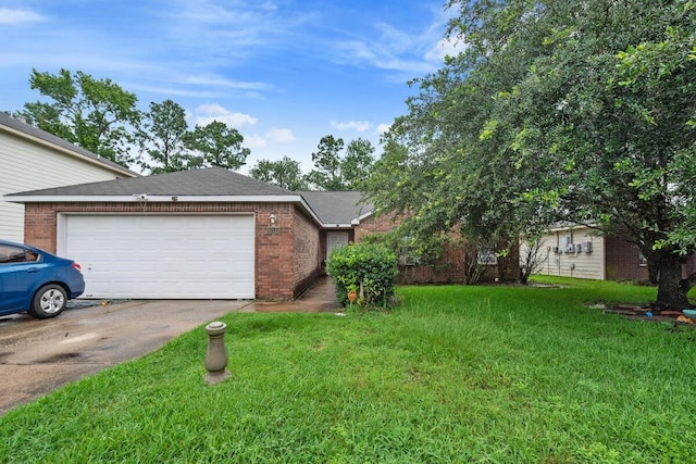 16145 Sun View Ln, Conroe, TX 77302 - view of front facade featuring brick siding, a front yard, asphalt driveway, and a garage