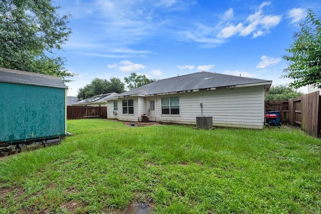 16145 Sun View Ln, Conroe, TX 77302 - back of house with a fenced backyard and a shed
