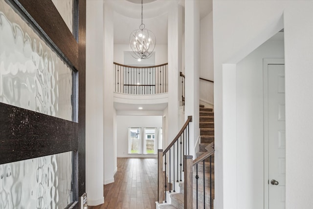 17471 Bayflower, Conroe, TX 77385 - entrance foyer with a towering ceiling, stairs, wood finished floors, and a chandelier