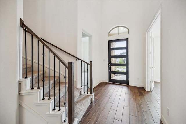 17471 Bayflower, Conroe, TX 77385 - foyer entrance featuring dark wood-type flooring, stairway, and a towering ceiling