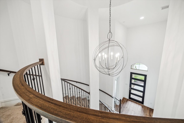 17471 Bayflower, Conroe, TX 77385 - staircase with a chandelier, wood finished floors, recessed lighting, and a towering ceiling