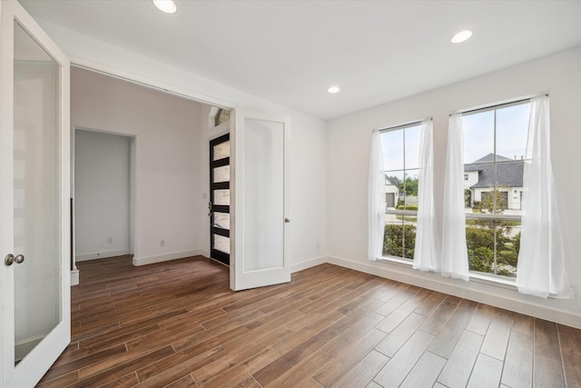 17471 Bayflower, Conroe, TX 77385 - spare room featuring wood finished floors and recessed lighting