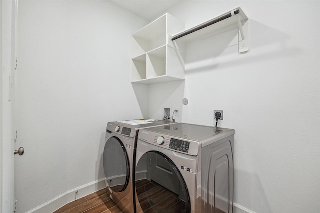 17471 Bayflower, Conroe, TX 77385 - laundry room featuring independent washer and dryer and dark wood finished floors